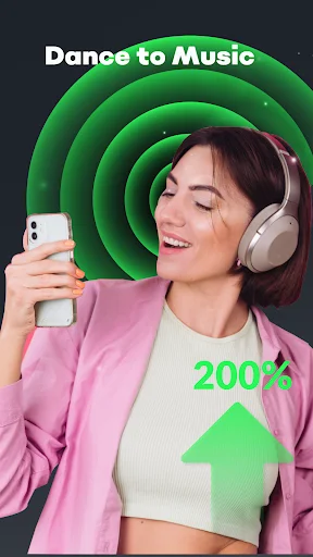 Woman dancing with headphones holding smartphone displaying 200 percent volume boost with green sound wave visualization effects