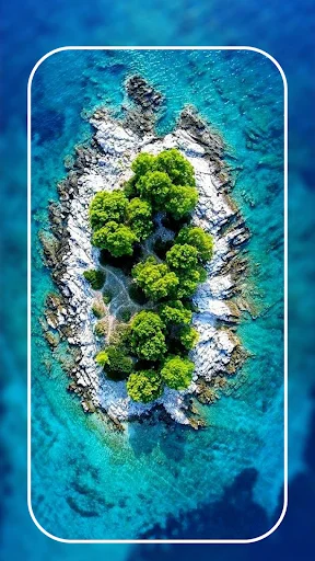Aerial view 4K wallpaper of tropical island with turquoise ocean waters displayed on mobile phone screen