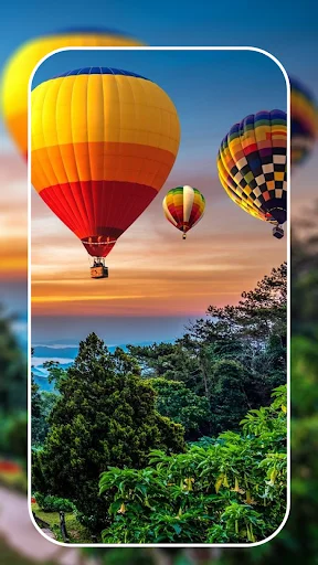 Vibrant hot air balloon 4K wallpaper over mountain landscape at sunset displayed on smartphone